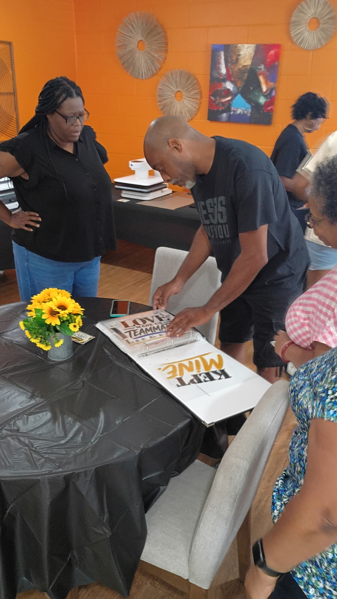 Guests participating at the shirt press station